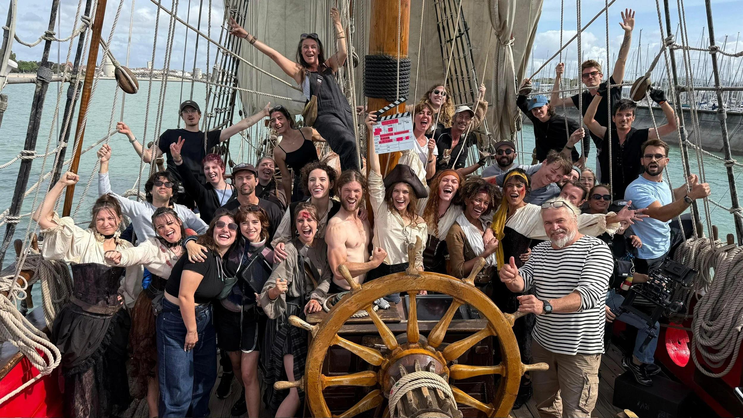 Tides Eye cast and crew in pirate costume aboard a real tall ship during filming
